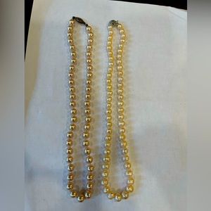 Two pink pearl necklaces. 1 genuine and one high quality glass